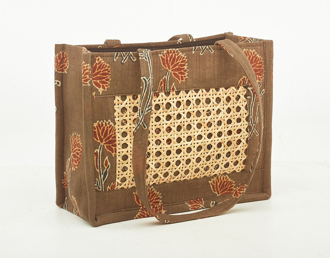 Peanut Brown Colored Fabric Bag, with Intricate Cane Work.
